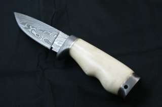 Custom damast hunting knife. Razor sharp and top leather sheath 