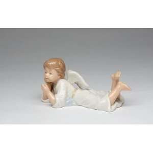 Boy Angel in White Robe w/ Wings Laying Down Blowing a Kiss Figurine 