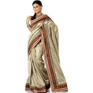 Ivory Wedding Sari Hand woven in Banaras with All Over Golden Bootis 