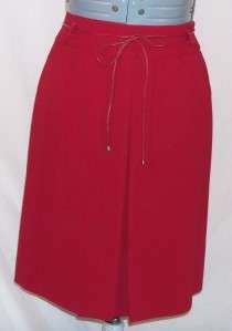 Like new deep red long sleeved skirt suit with belt by Jones New York.