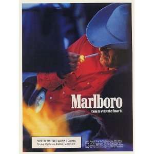   Man Cowboy Lighting Cigarette Print Ad (52459)