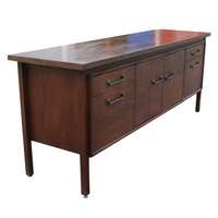 Mid Century wood credenza with laminate top. Features 4 drawers and 2 