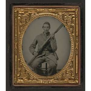  soldier in Confederate uniform with musket