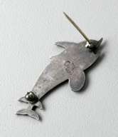 Sterling silver pin of a pair of dolphins, impressed company marks on 