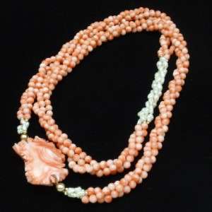 Natural coral and freshwater pearls in a lovely three strand necklace 