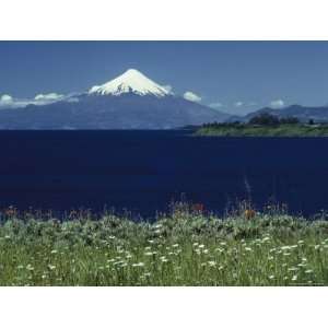  The Snow Capped Top of Osorno Volcano Towers over Lake 