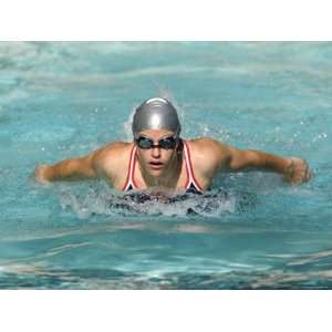  Young Woman Swimming the Butterfly Stroke in a Swimming Pool 